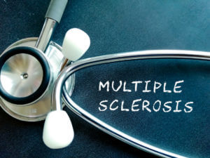 An image featuring the words Multiple Sclerosis displayed on a black background alongside a stethoscope.