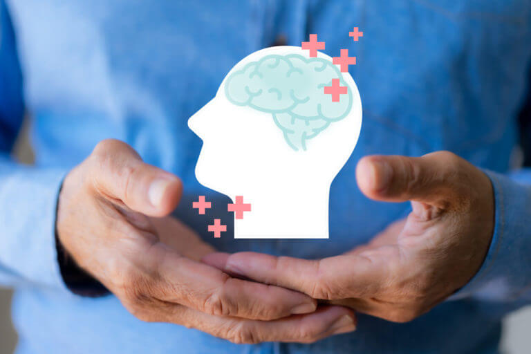 A cut-out paper representation of a human brain, accompanied by multiple plus icons, is used to illustrate memory improvement.