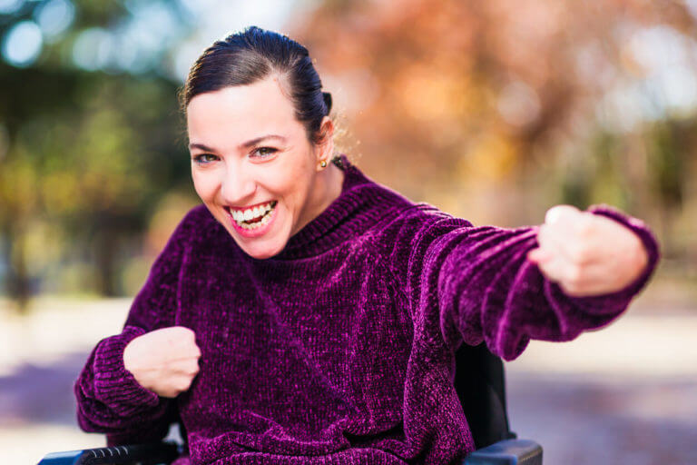 a woman with Cerebral Palsy smiling